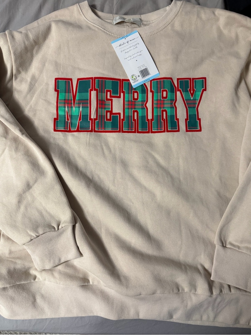 State of Mind Cream Crewneck with Red and Green Plaid 'MERRY' Graphic